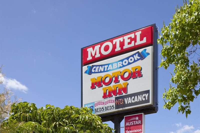 The Centabrook Motor Inn street sign against a blue sky
